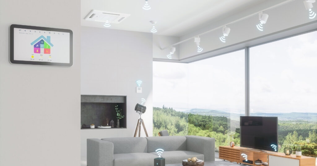 A bright, modern room with large windows, a gray sofa, and a clean, minimal design.