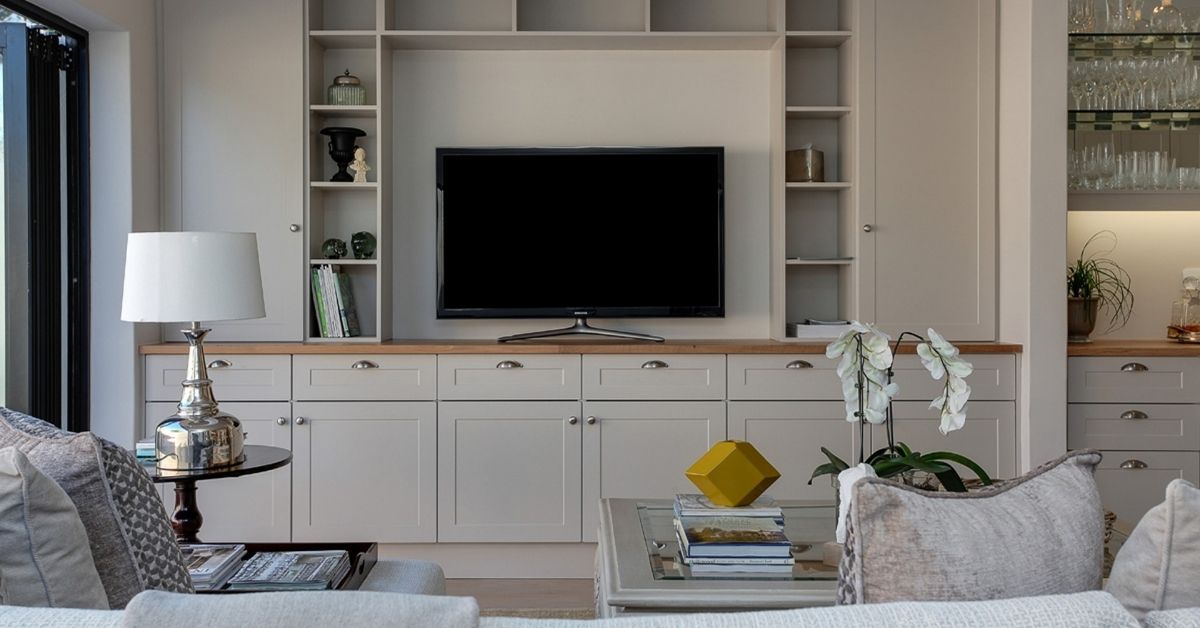 Modern TV lounge design with built-in shelves and cozy seating