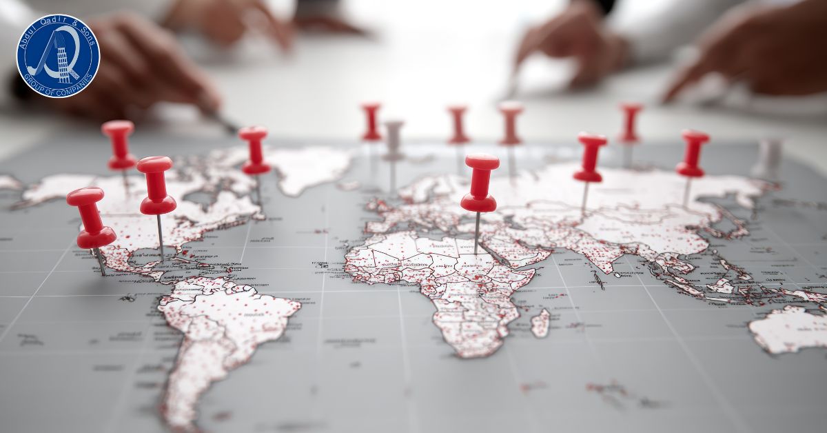 Global map with red location pins showing Aqsons Construction project presence and international planning services.