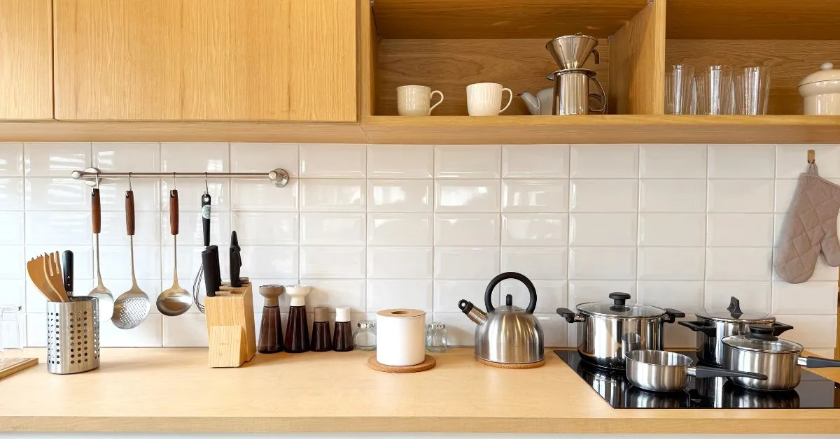 Modern Pakistani kitchen with cabinets, appliances and backsplash design